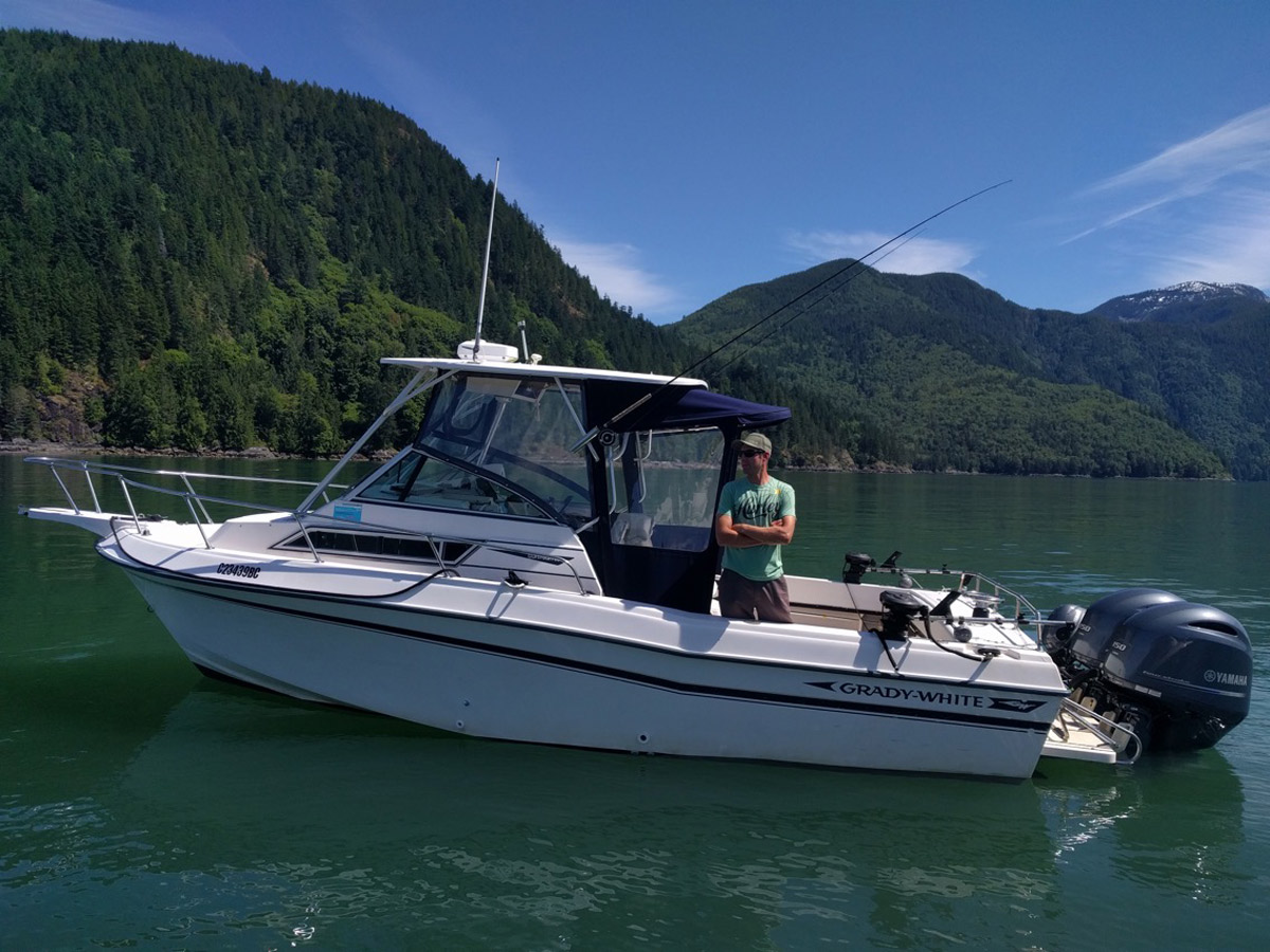 Captain Kyle onboard his Grady White Boat